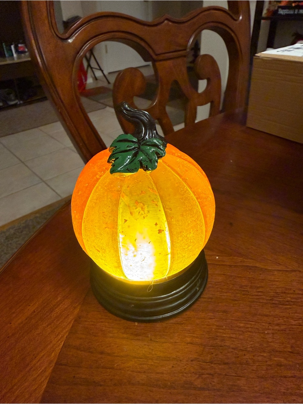 Illuminated Orange Pumpkin Lantern Accent with Green Leaf